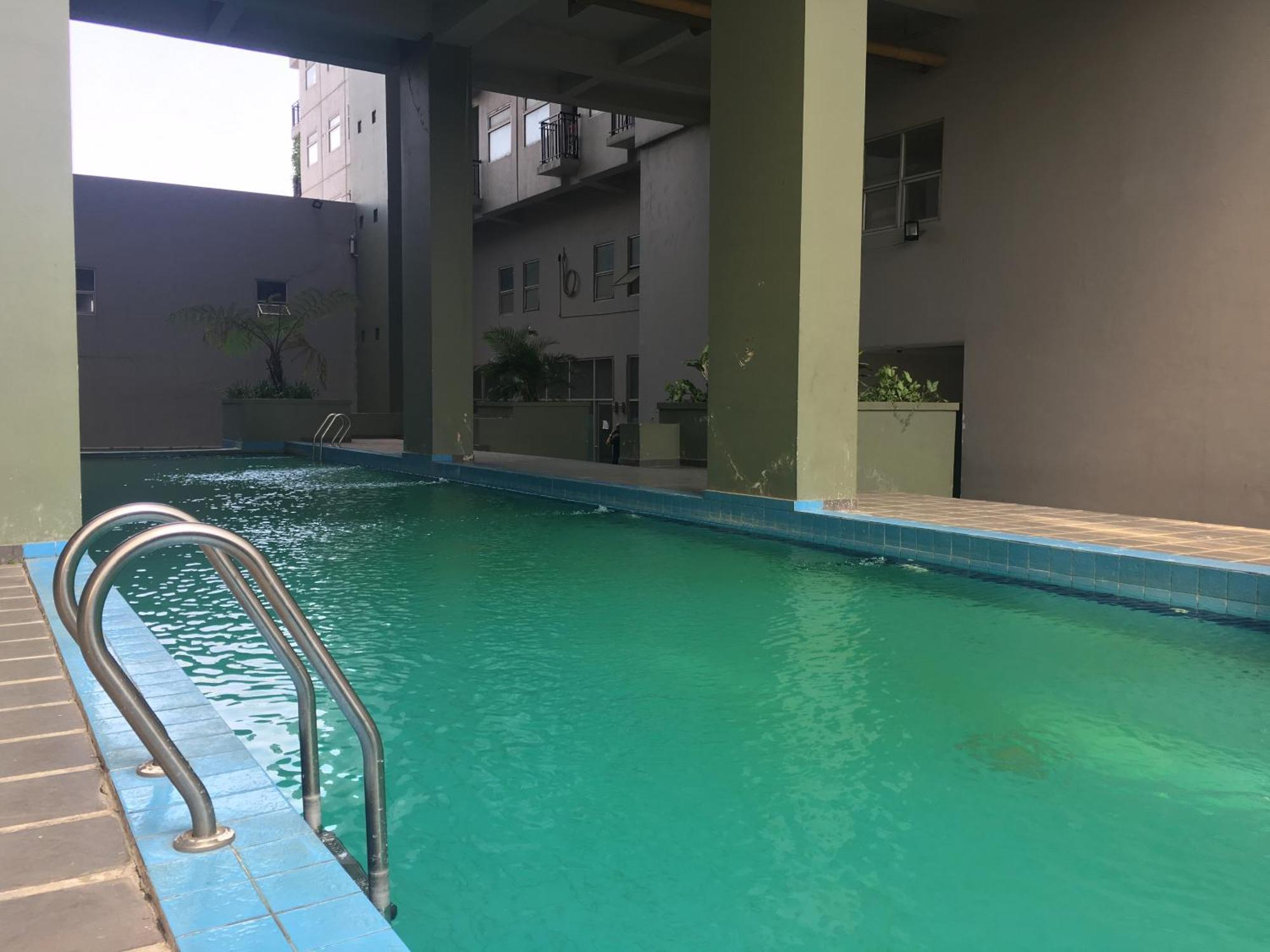Scandinavian At Grand Afrika By Travelio Apartemen